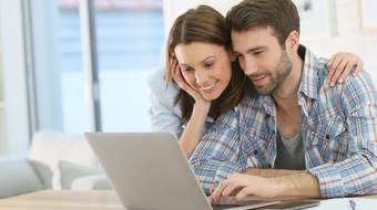 Two people with laptop